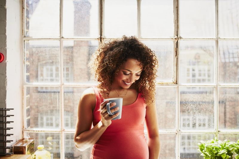 Pregnant woman with a cup of coffe?