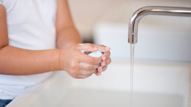 Child washing hands