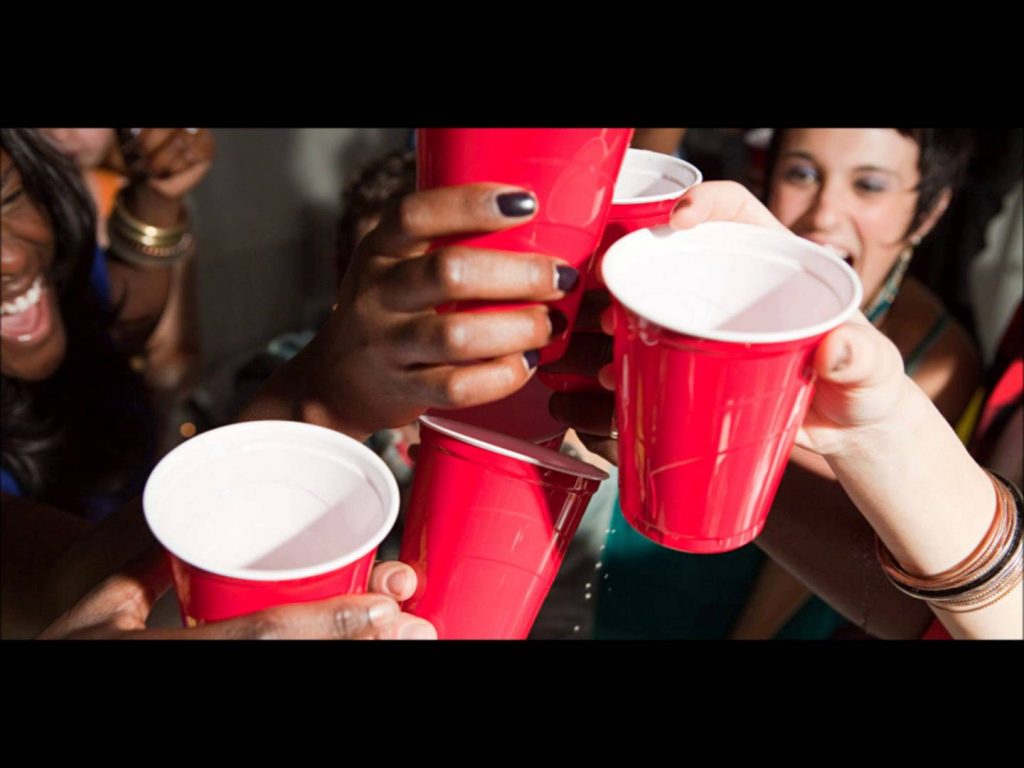 raising the red cup with alcohol