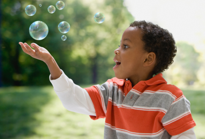 Boy Child Blowing Bubbles Park 04202015 Healthfacts