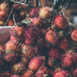 Rambutan fruits on the asian night market. Bali island.