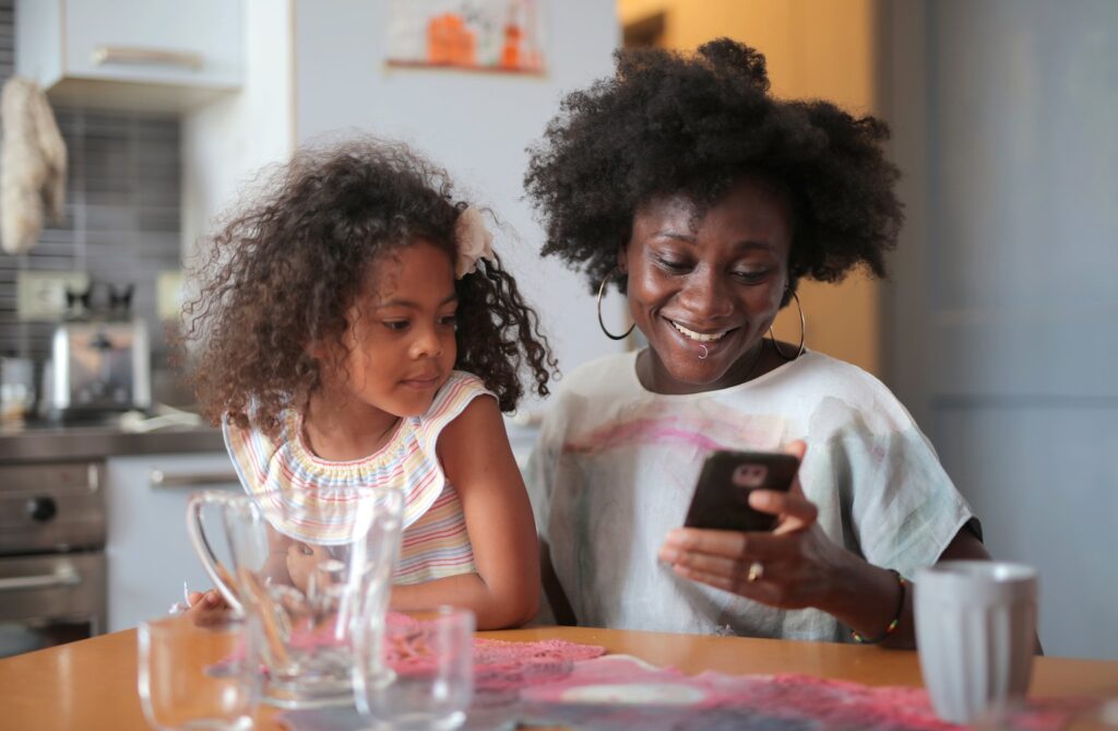 Child staring at phone screen