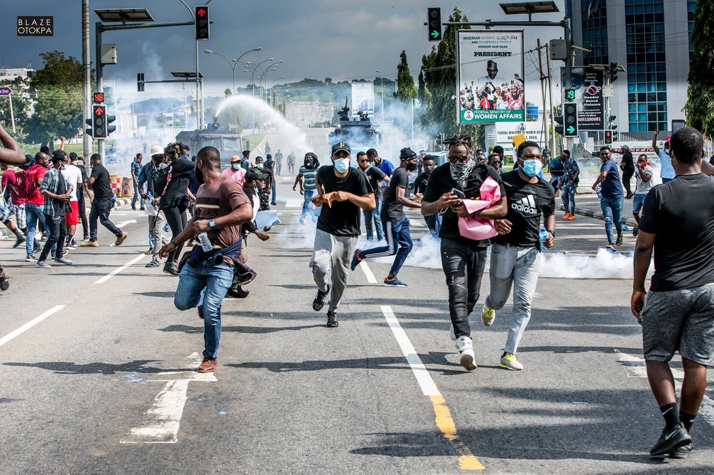 Protesters running