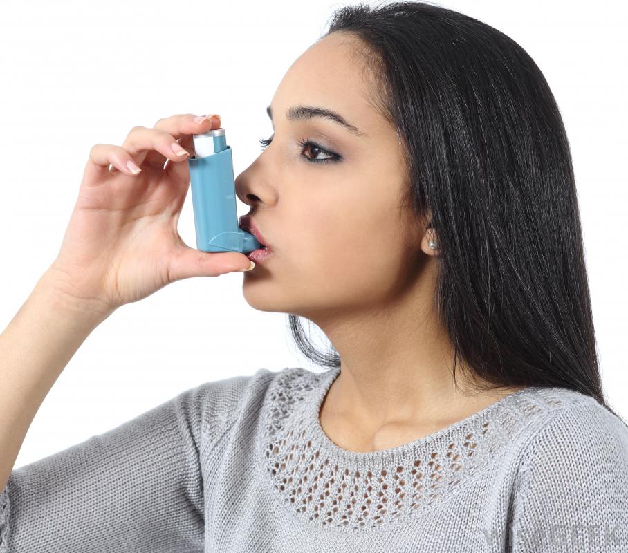 Woman using inhaler