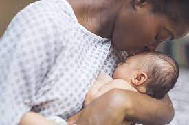 mother kissing baby