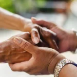 Two_Mature_Adult_Women_Holding_Hands